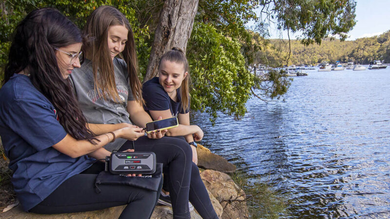 IS920 being used as a power bank by children - lifestyle image